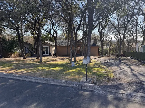 a view of a porch with a table and chairs