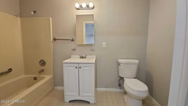 a bathroom with a toilet sink and a bathtub