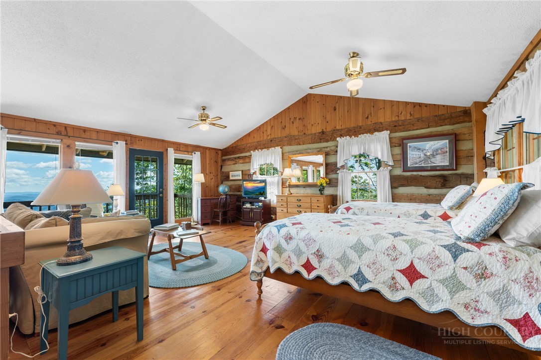 2177 Homestead Road Todd, NC 28684 - Photo 21 of 49 a bedroom with furniture and a large window