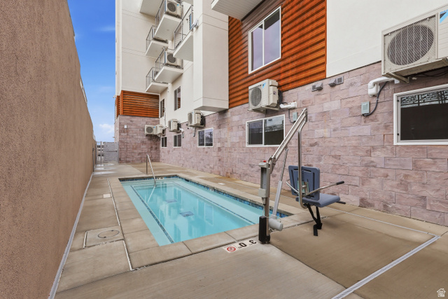 2085 North Main Street, Unit 107 Sunset, UT 84015 - Photo 21 of 21 View of heated spa and patio surround