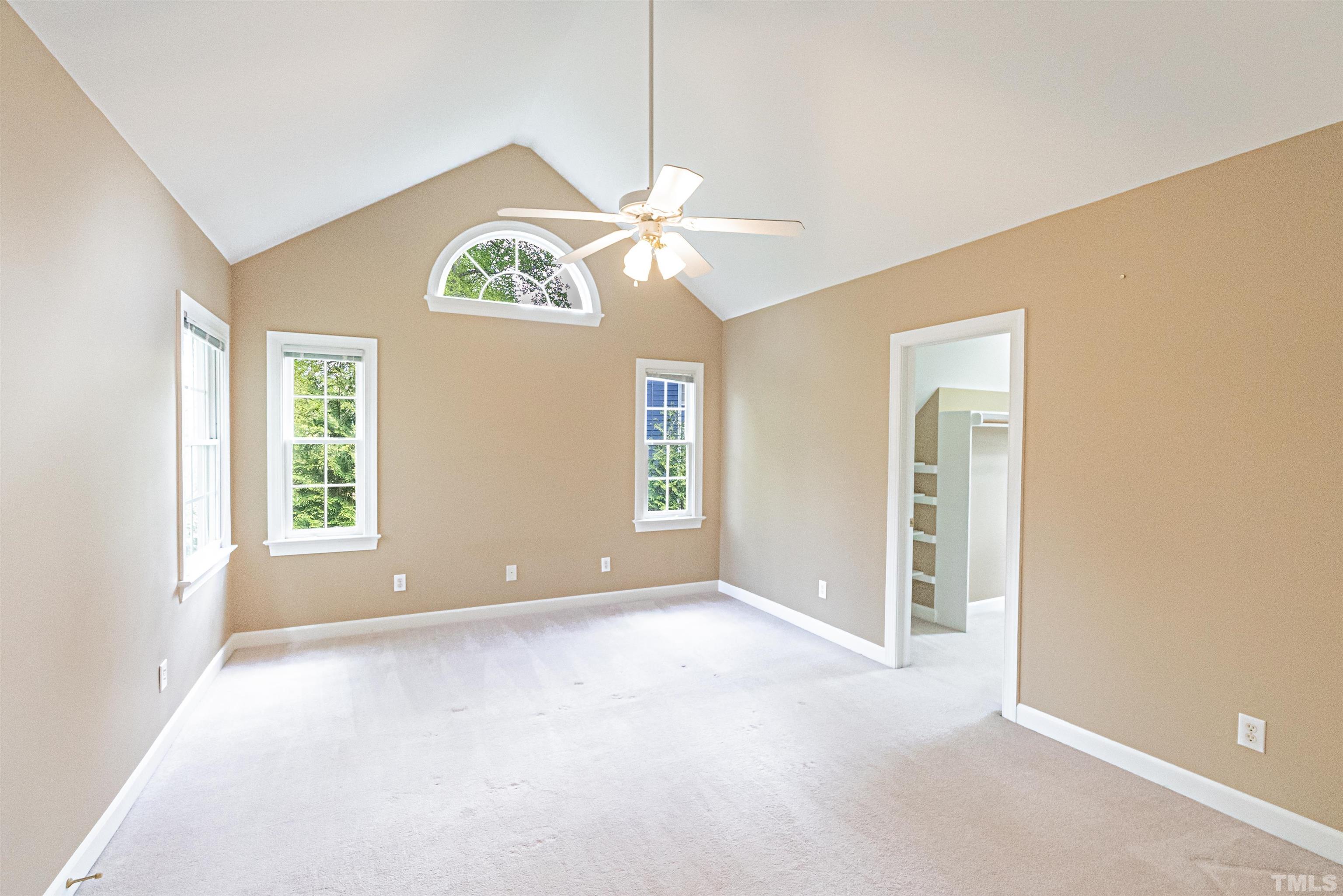 2505 Sugar Maple Court Raleigh, NC 27615 - Photo 22 of 41 an empty room with windows and fan