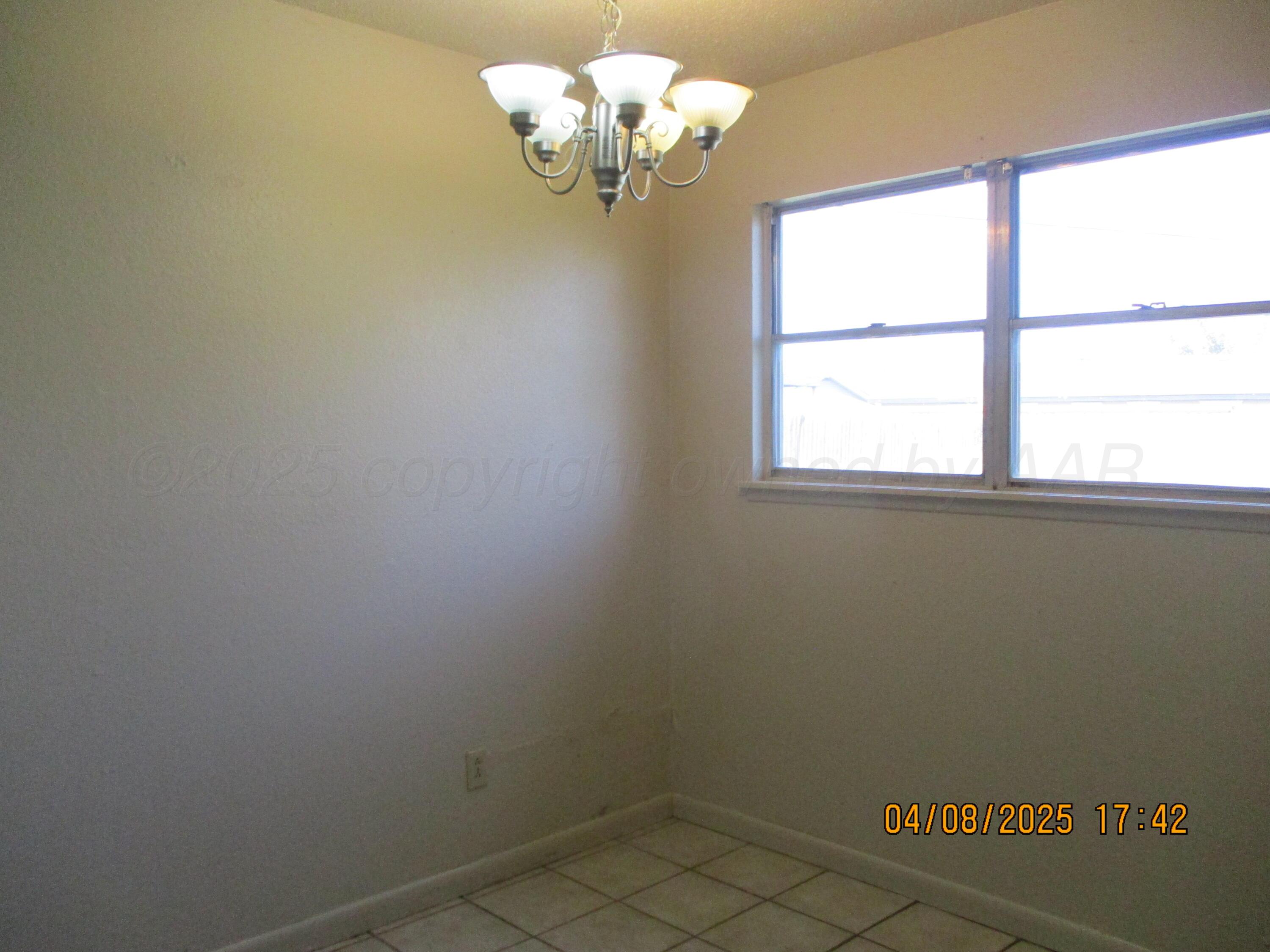 2913 Ricks Street Amarillo, TX 79103 - Photo 4 of 14 a view of a chandelier in a room