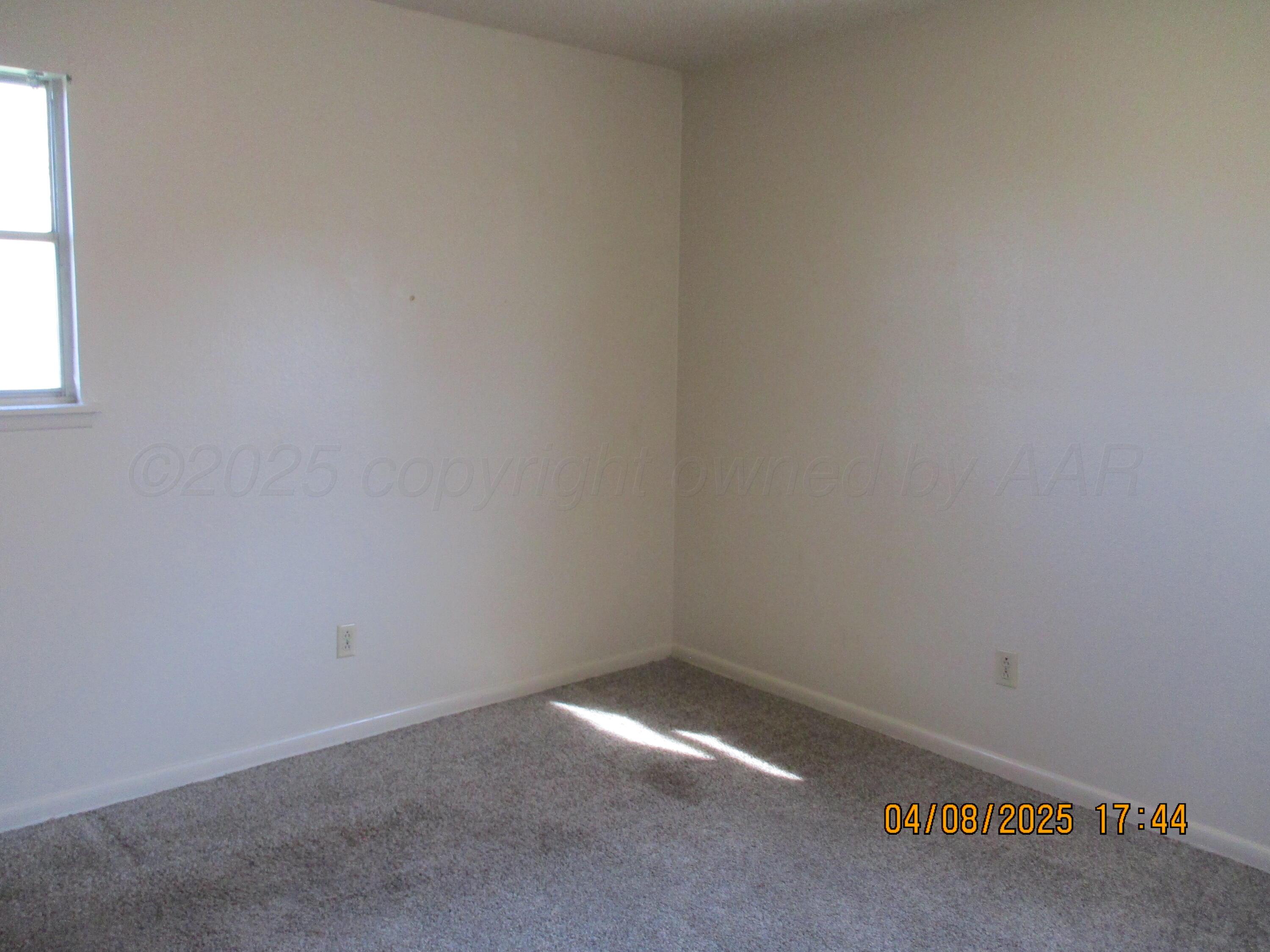 2913 Ricks Street Amarillo, TX 79103 - Photo 8 of 14 an empty room with a window