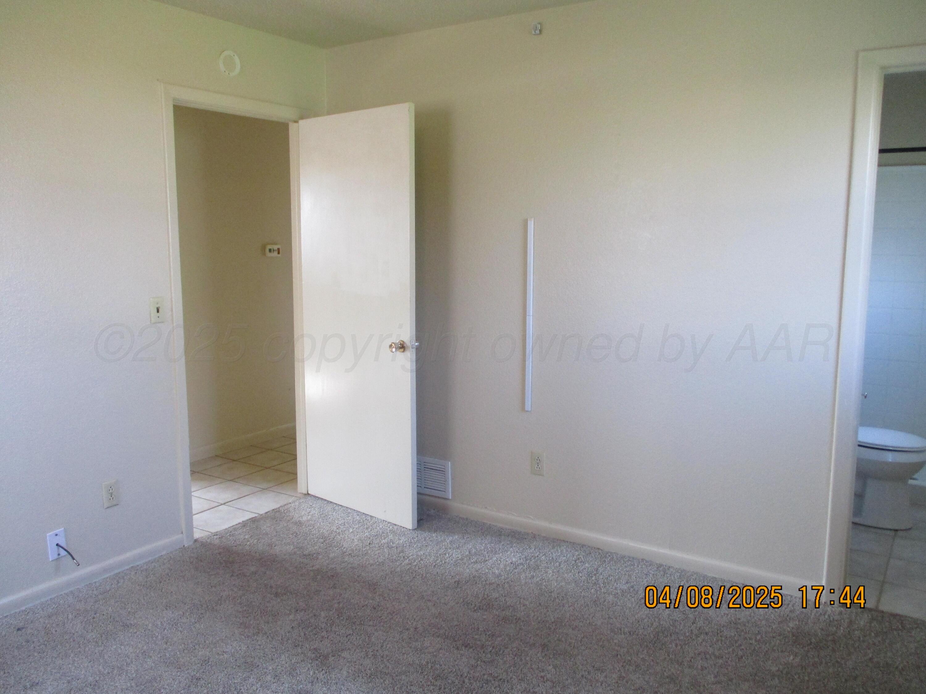 2913 Ricks Street Amarillo, TX 79103 - Photo 9 of 14 an empty room with closet