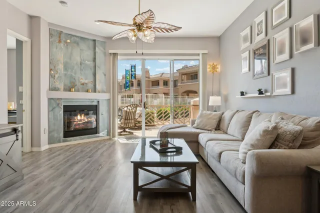 a living room with furniture and a fireplace