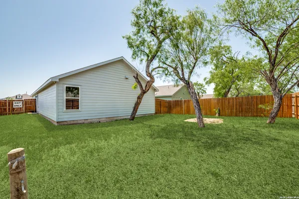 a backyard of a house with lots of green space