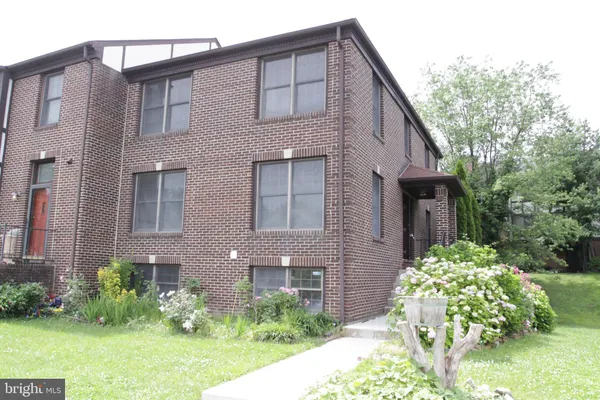 a street sign on a pole on a street