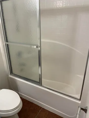 an entryway door with a hallway in the back