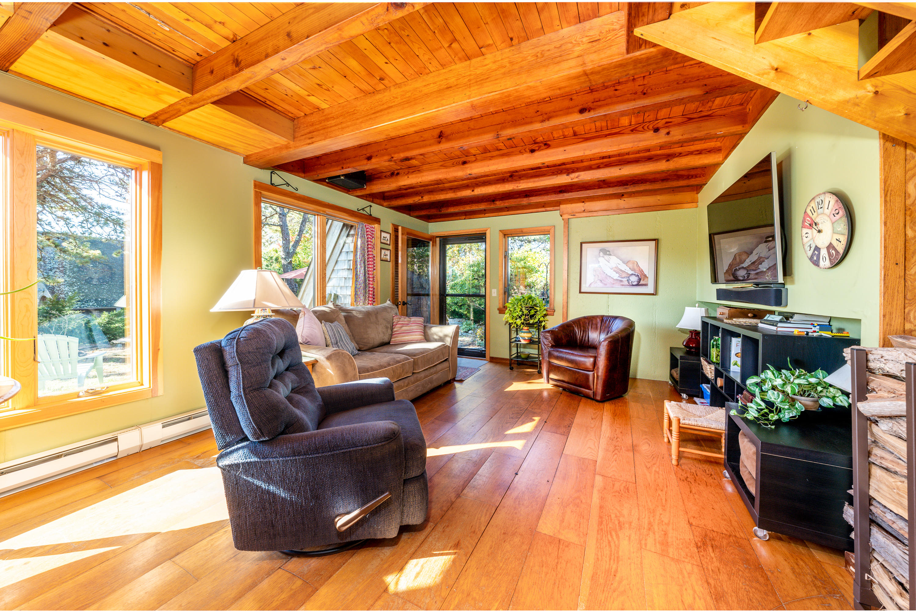 80 Peace Valley Road Wellfleet, MA 02667 - Photo 13 of 52 a living room with furniture fireplace and a large window