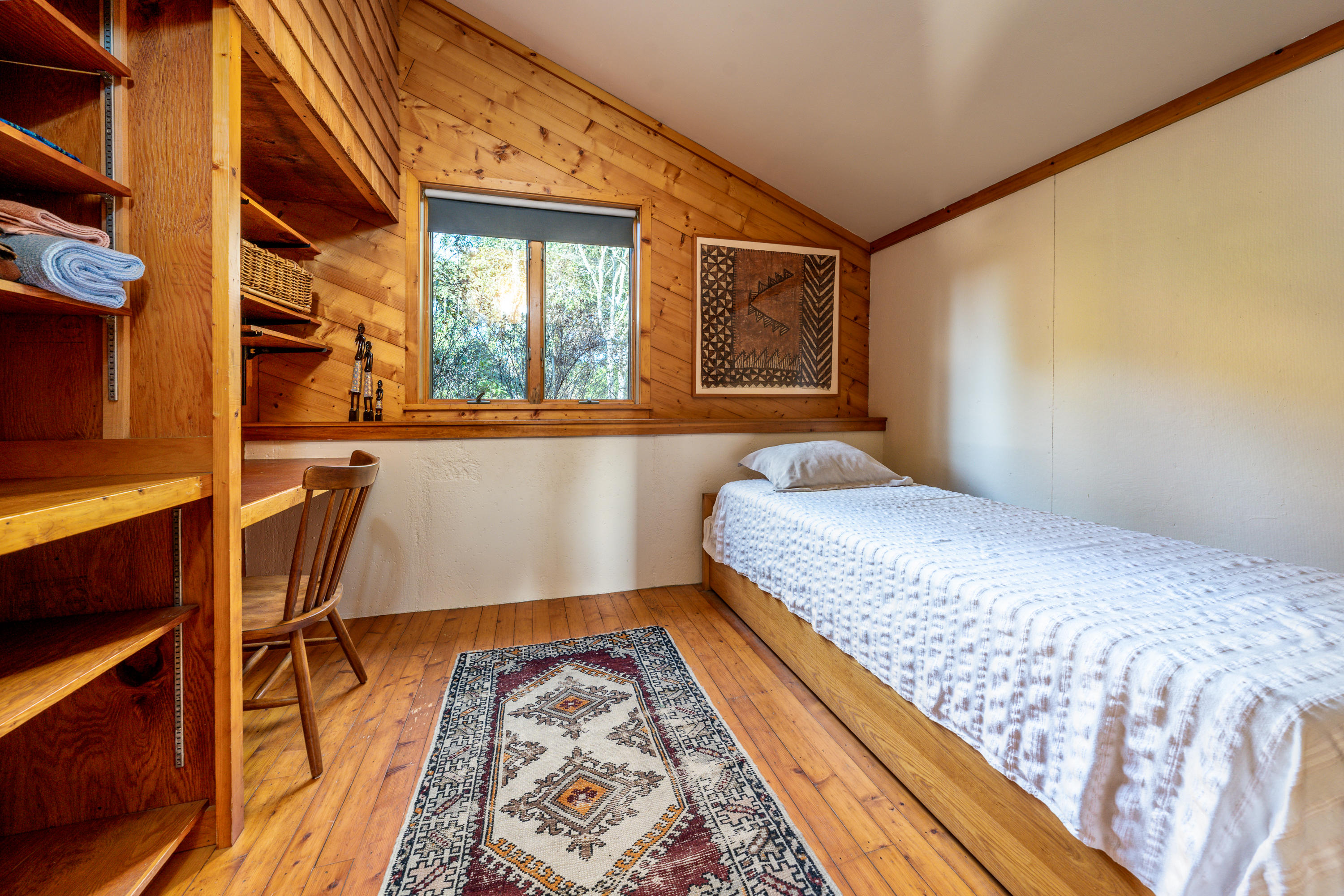 80 Peace Valley Road Wellfleet, MA 02667 - Photo 20 of 52 a bedroom with a bed and wooden floor