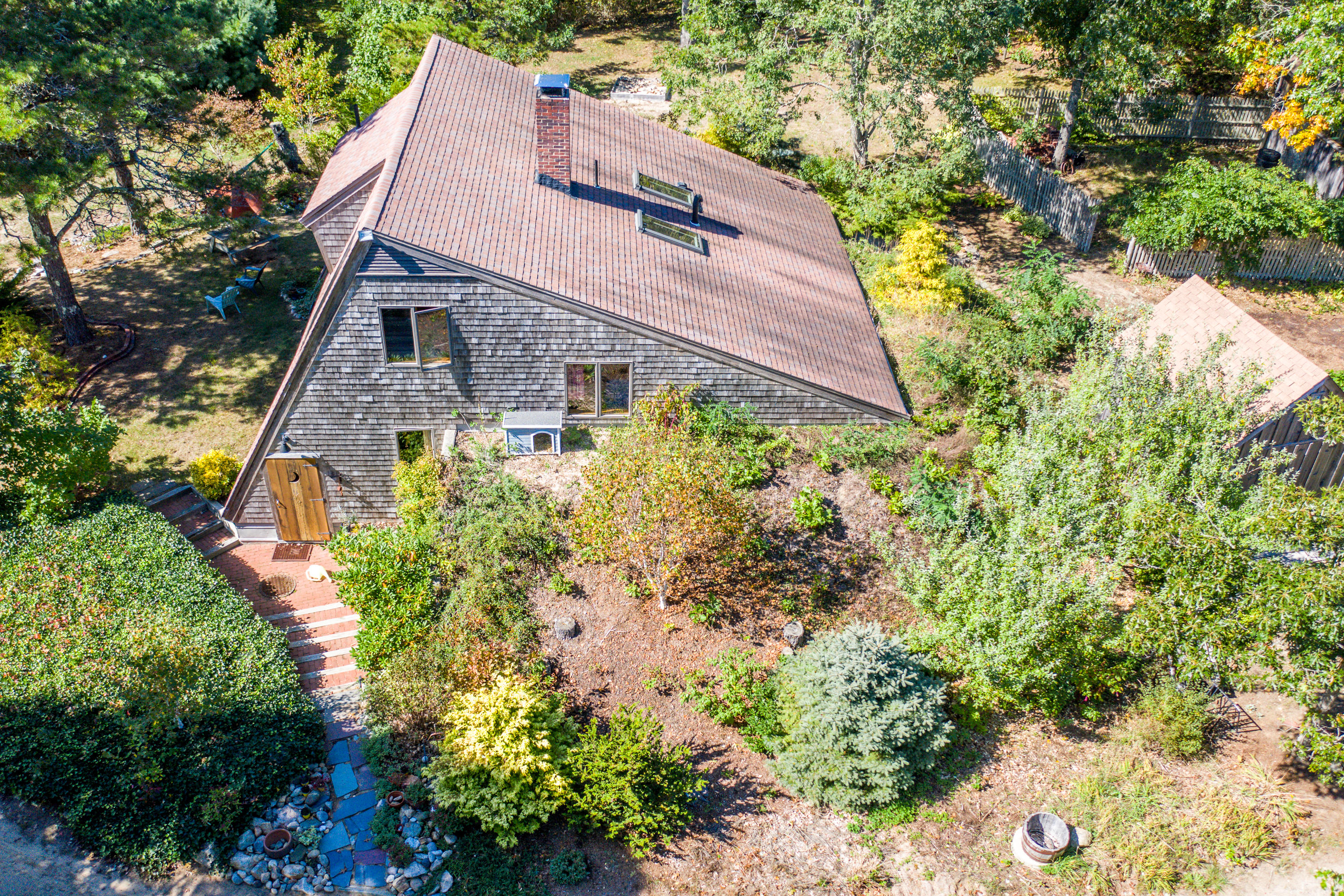 80 Peace Valley Road Wellfleet, MA 02667 - Photo 2 of 52 a aerial view of a house with a yard and large trees
