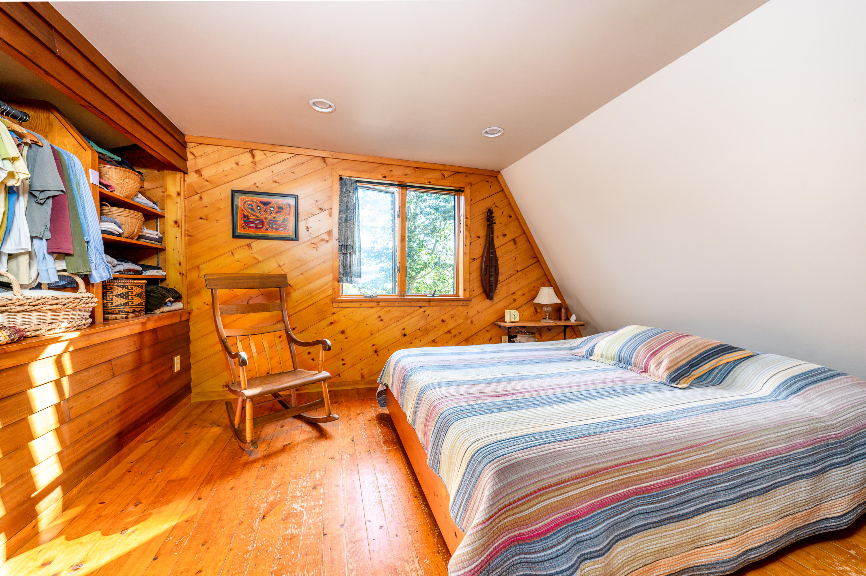 80 Peace Valley Road Wellfleet, MA 02667 - Photo 27 of 52 a bedroom with a bed and a night stand