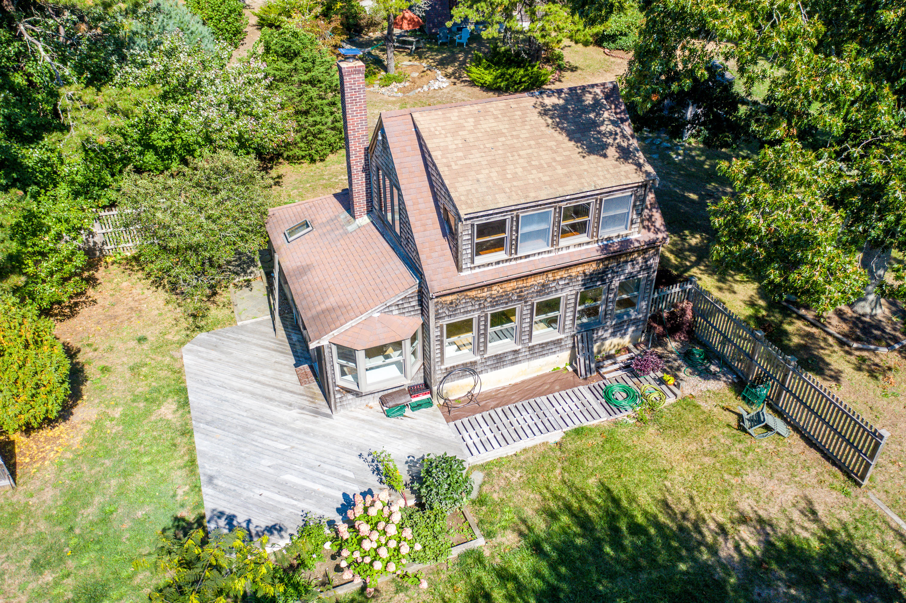 80 Peace Valley Road Wellfleet, MA 02667 - Photo 29 of 52 an aerial view of a house with swimming pool and large trees