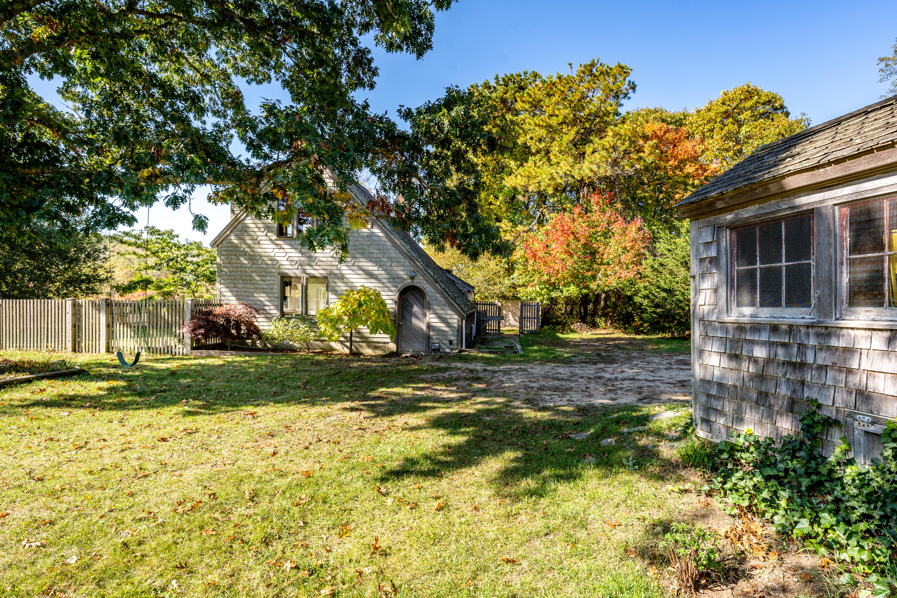 80 Peace Valley Road Wellfleet, MA 02667 - Photo 34 of 52 a view of a yard in front of a house with large trees