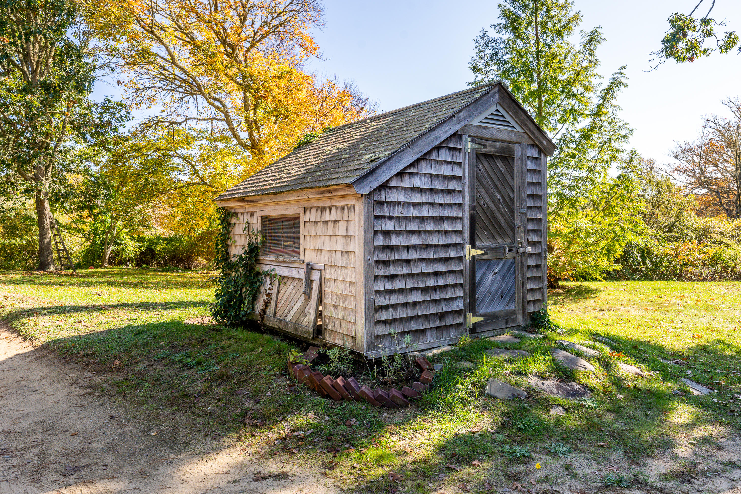 80 Peace Valley Road Wellfleet, MA 02667 - Photo 35 of 52 a view of a house with backyard and garden