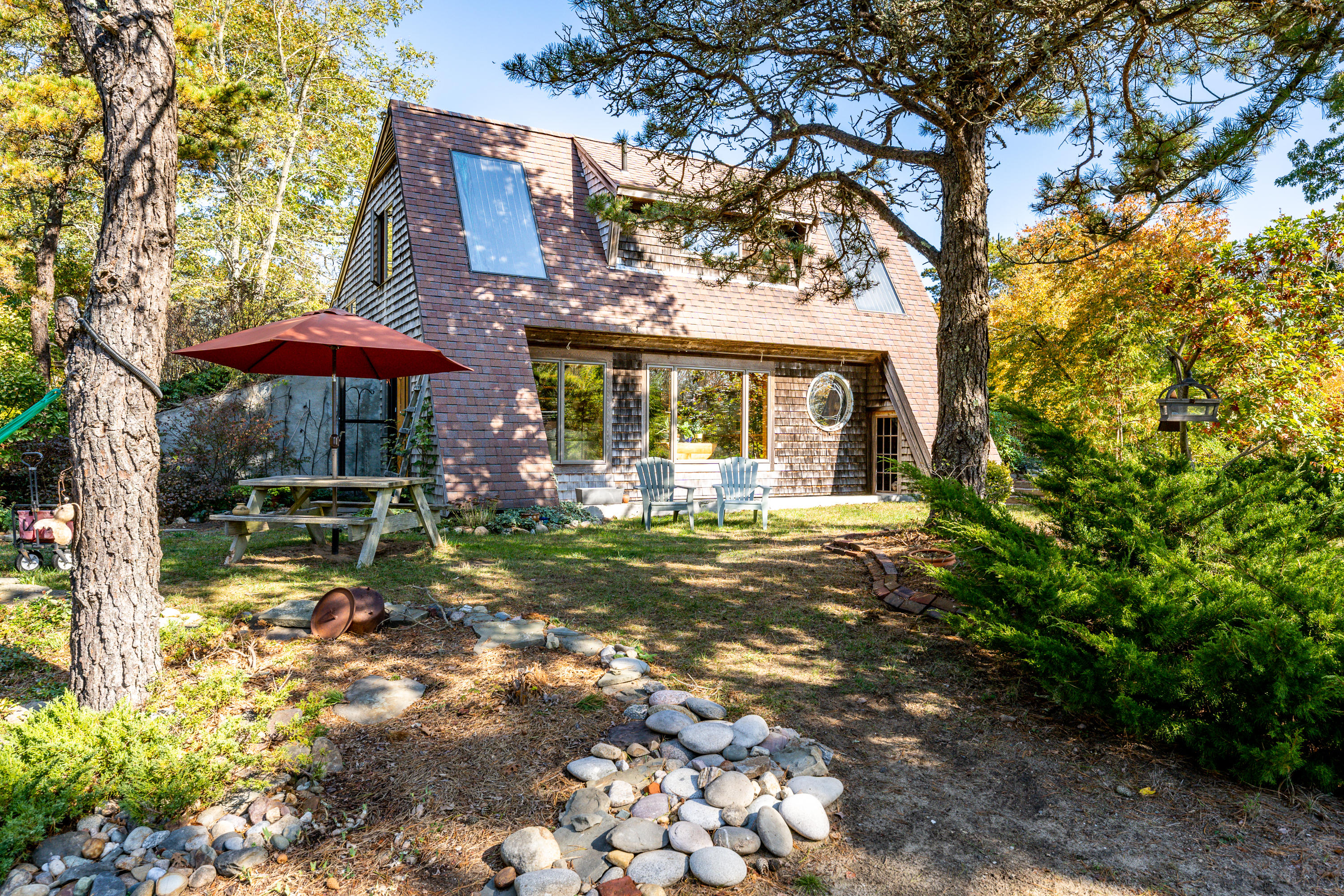 80 Peace Valley Road Wellfleet, MA 02667 - Photo 10 of 52 a front view of a house with garden