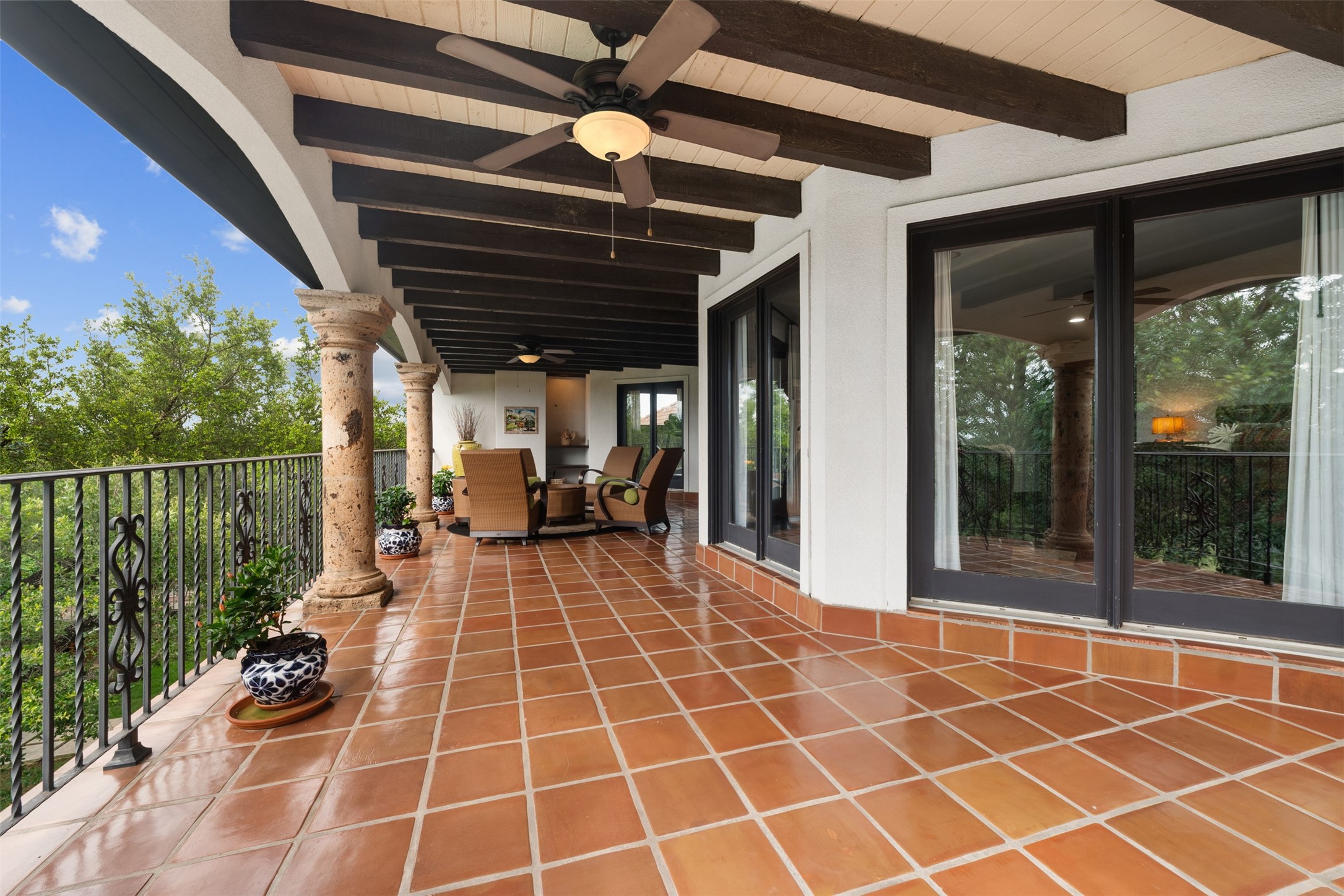 34000 Smithson Valley Road Bulverde, TX 78163 - Photo 32 of 50 The Mediterranean-inspired courtyard features a classic fountain, covered walkways, and authentic architectural details. This tranquil outdoor space seamlessly connects the home’s indoor and outdoor living areas.