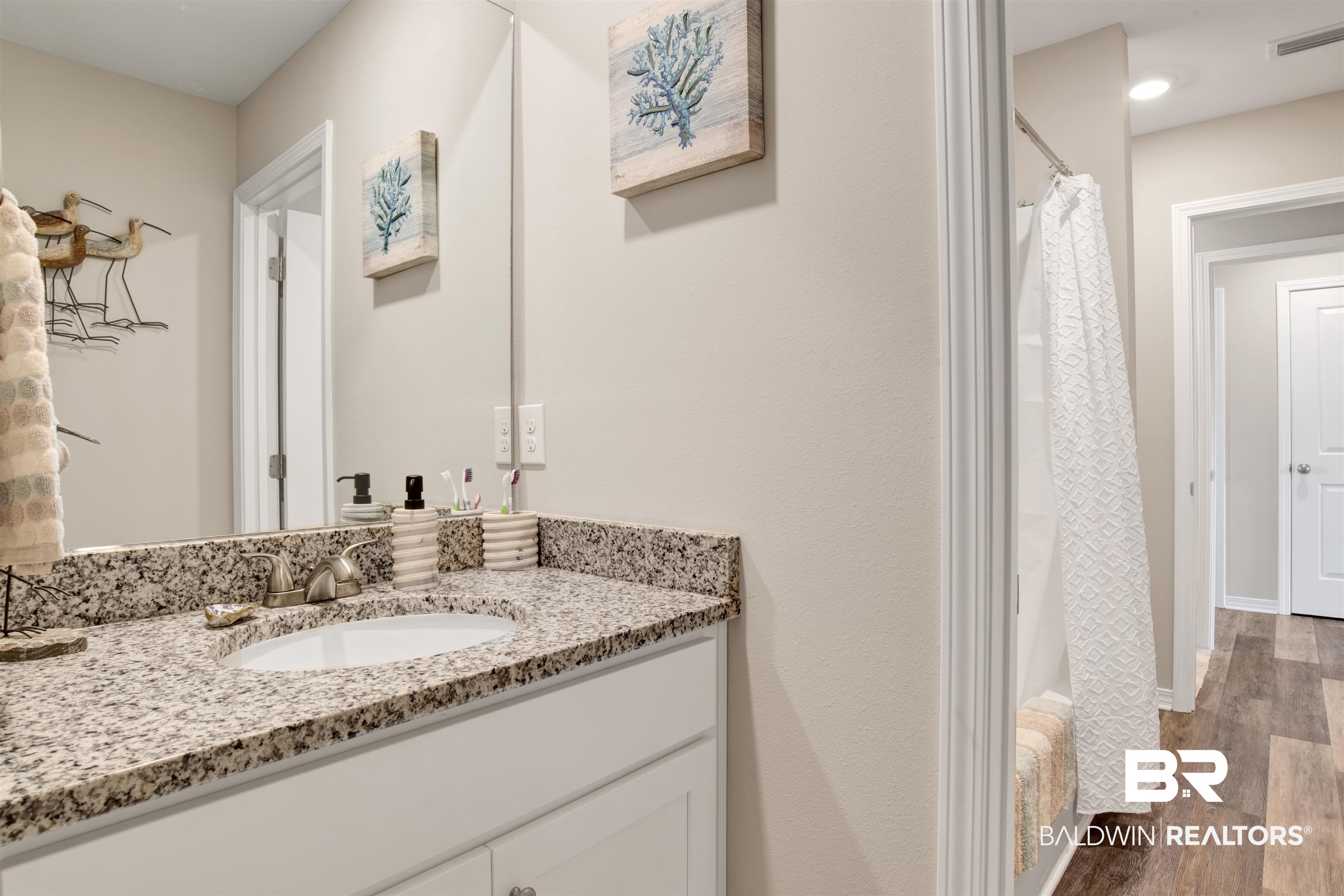 3097 Ingrid Lane Foley, AL 36535 - Photo 25 of 38 Bathroom featuring vanity and hardwood / wood-style floors