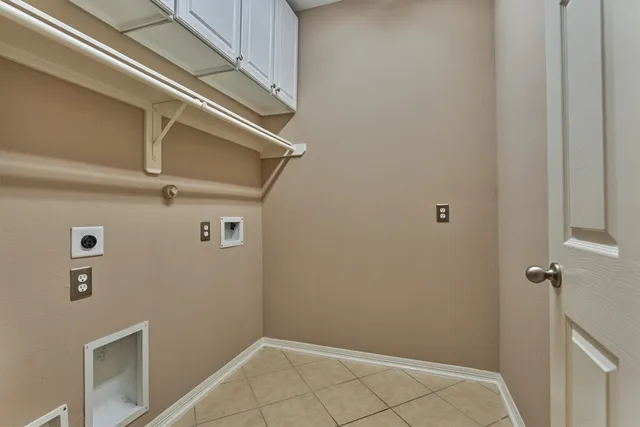a kitchen with granite countertop a sink stove and cabinets