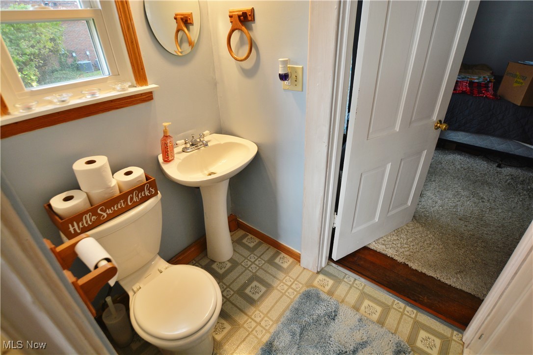 6696 Madison Road Thompson, OH 44086 - Photo 10 of 24 Ensuite bathroom featuring toilet and baseboards