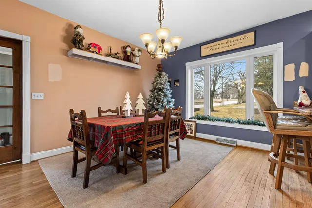 a living room with furniture a fireplace with window