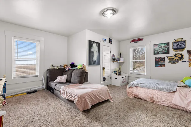 a bedroom with bed and a closet