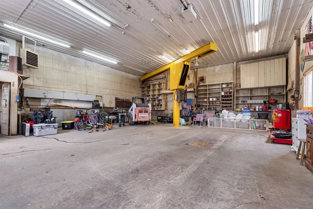 a large tree with wooden fence