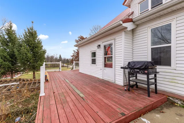 a kitchen with stainless steel appliances a sink counter space cabinets and a window