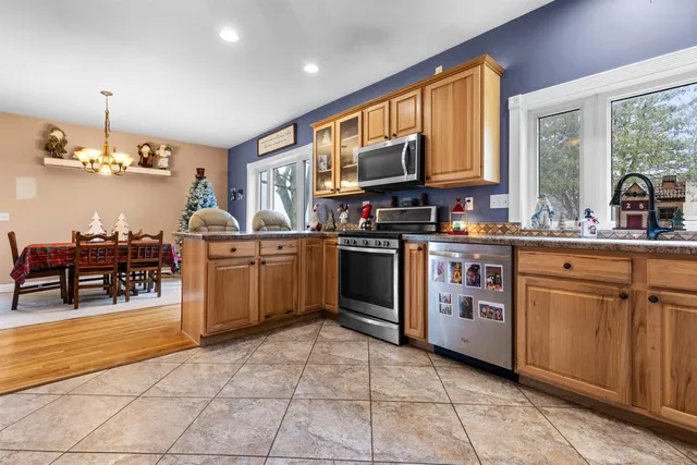 a kitchen with a stove a sink and a microwave