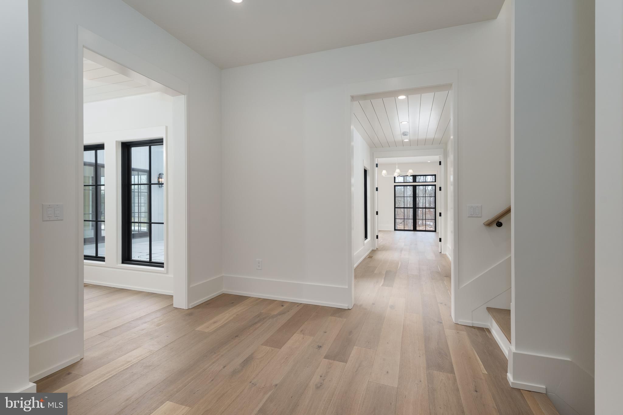 241 Carter Road Princeton, NJ 08540 - Photo 11 of 28 an empty room with wooden floor and windows