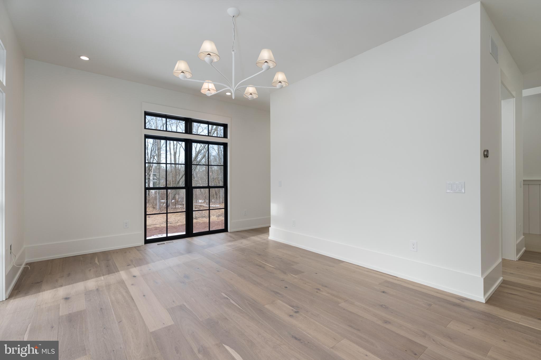 241 Carter Road Princeton, NJ 08540 - Photo 13 of 28 wooden floor in an empty room with a window