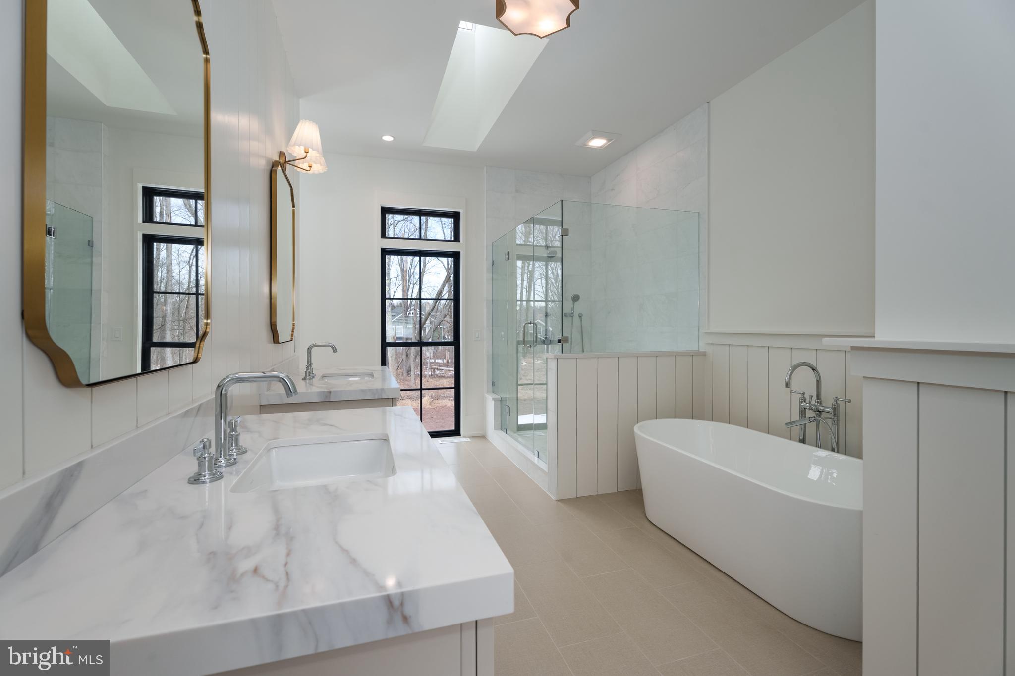 241 Carter Road Princeton, NJ 08540 - Photo 16 of 28 a bathroom with a tub sink and mirror