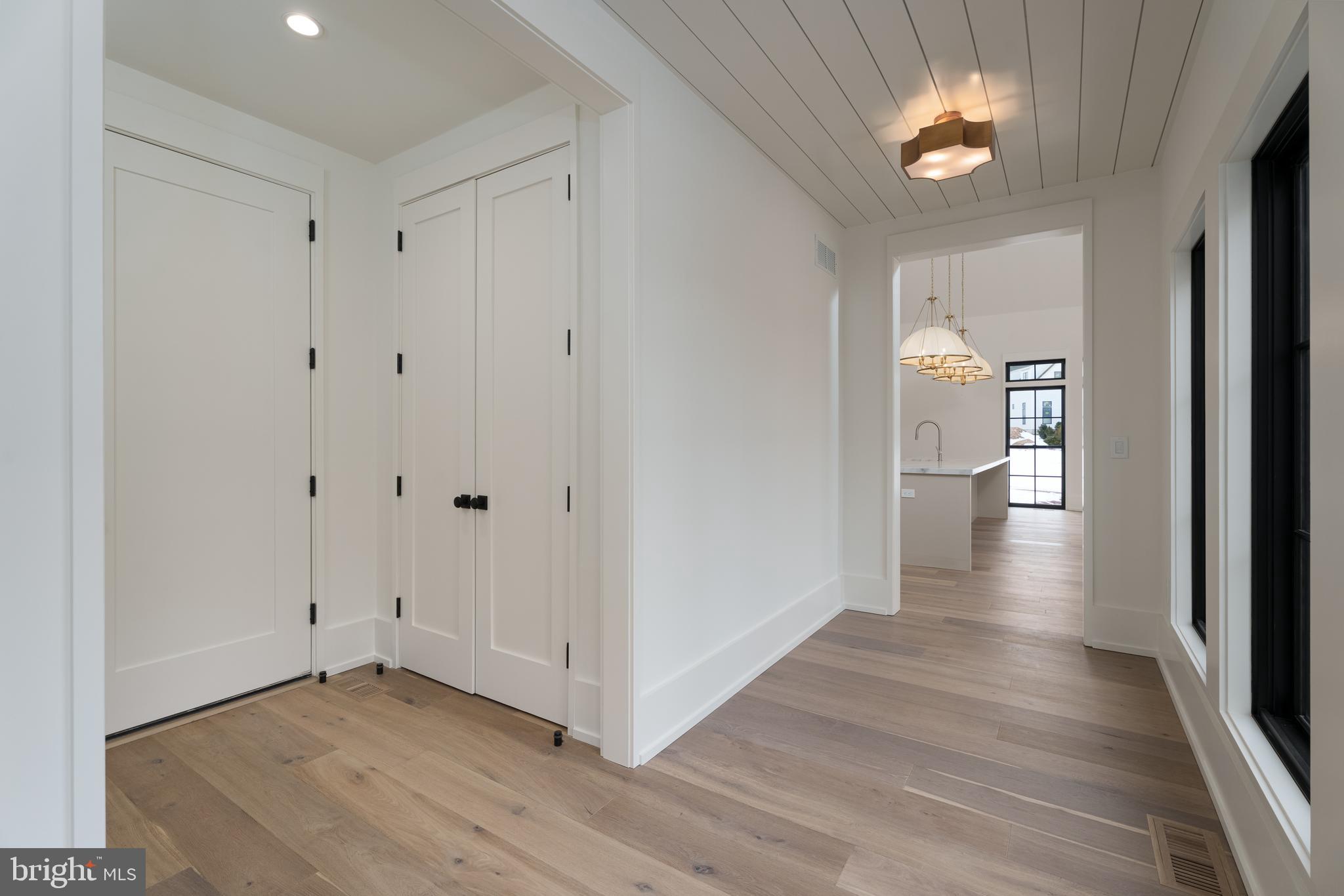 241 Carter Road Princeton, NJ 08540 - Photo 4 of 28 a view of an empty room with wooden floor