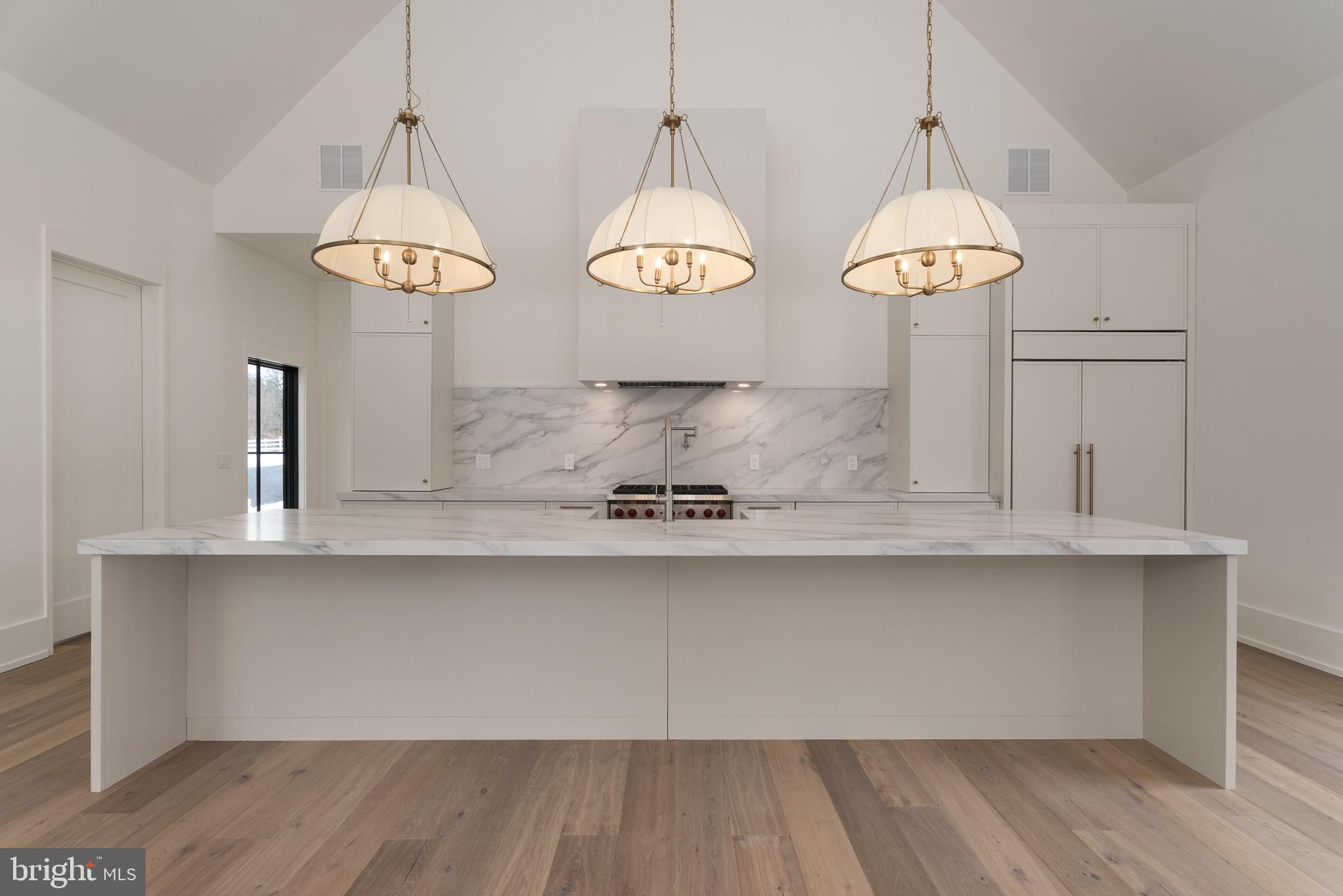 241 Carter Road Princeton, NJ 08540 - Photo 8 of 28 a view of a room with wooden floor and chandelier