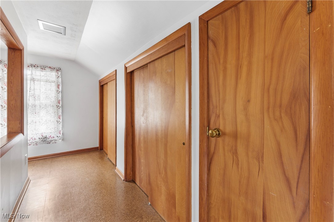 1703 Ferndale Road Northwest Canton, OH 44709 - Photo 21 of 34 Hallway featuring lofted ceiling and light floors