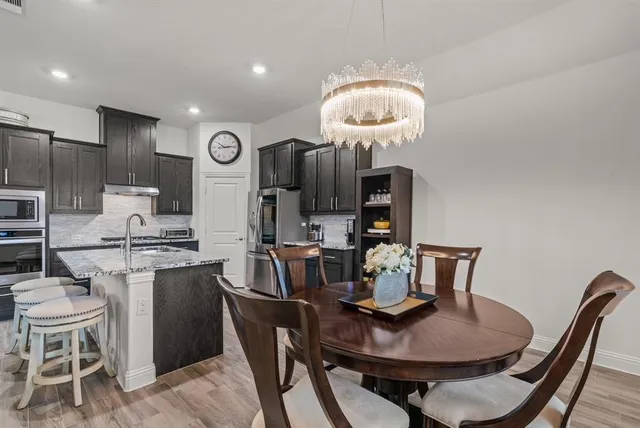 a view of a dining room with furniture