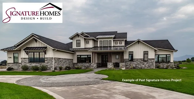 a view of a house with a park next to a road