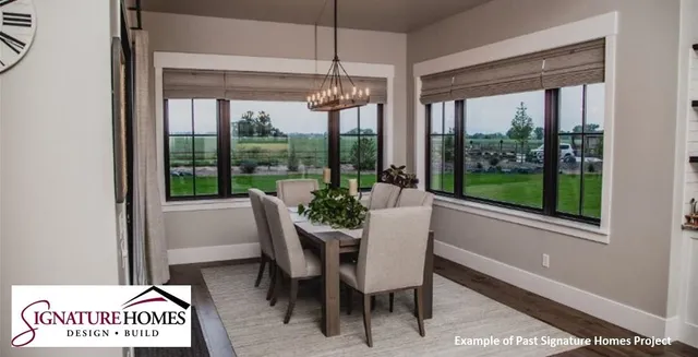 a kitchen with a stove a counter top space and a dining table