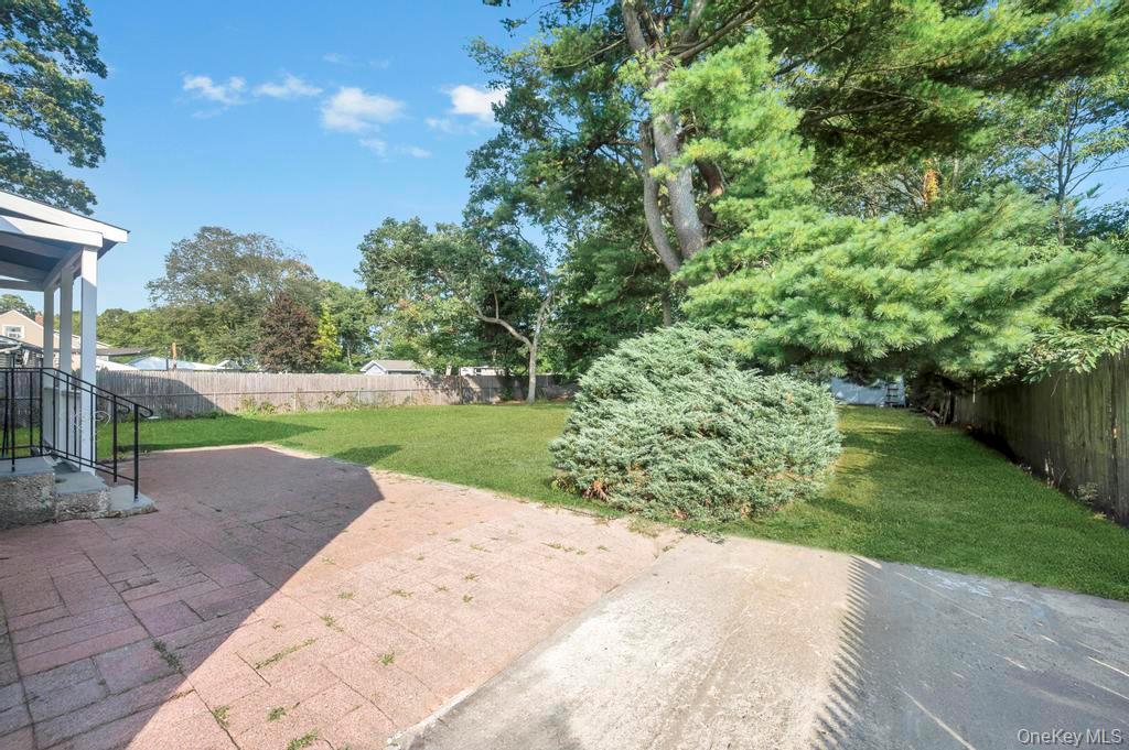 815 Udall Road West Islip, NY 11795 - Photo 41 of 45 Fenced backyard with a patio area