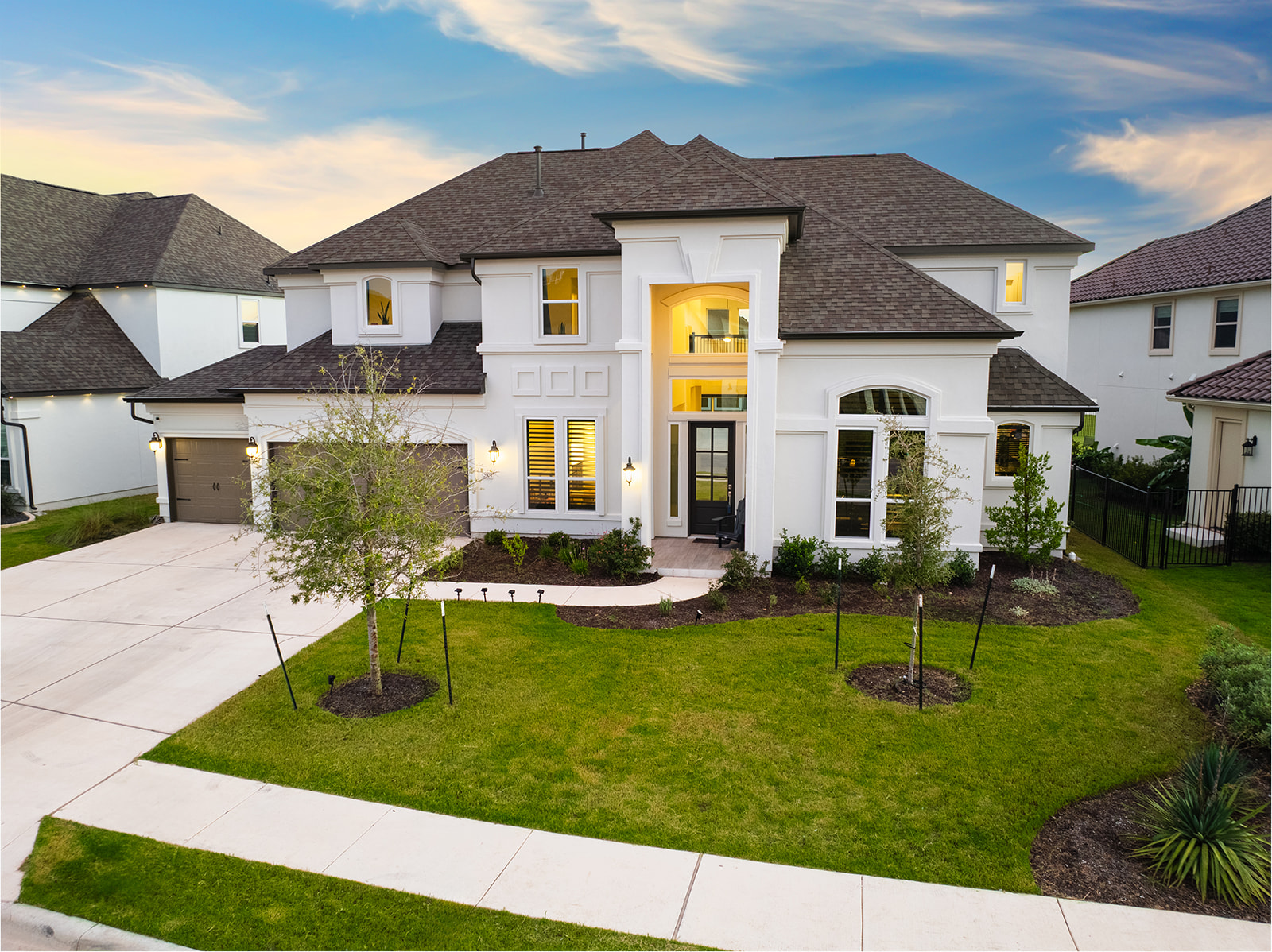 a front view of a house with a yard table and chairs