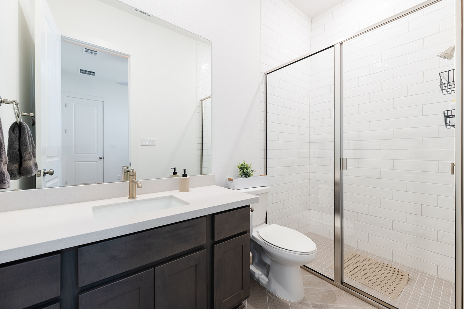 2905 Canto Trace Leander, TX 78641 - Photo 25 of 40 a bathroom with a double vanity sink toilet and a mirror