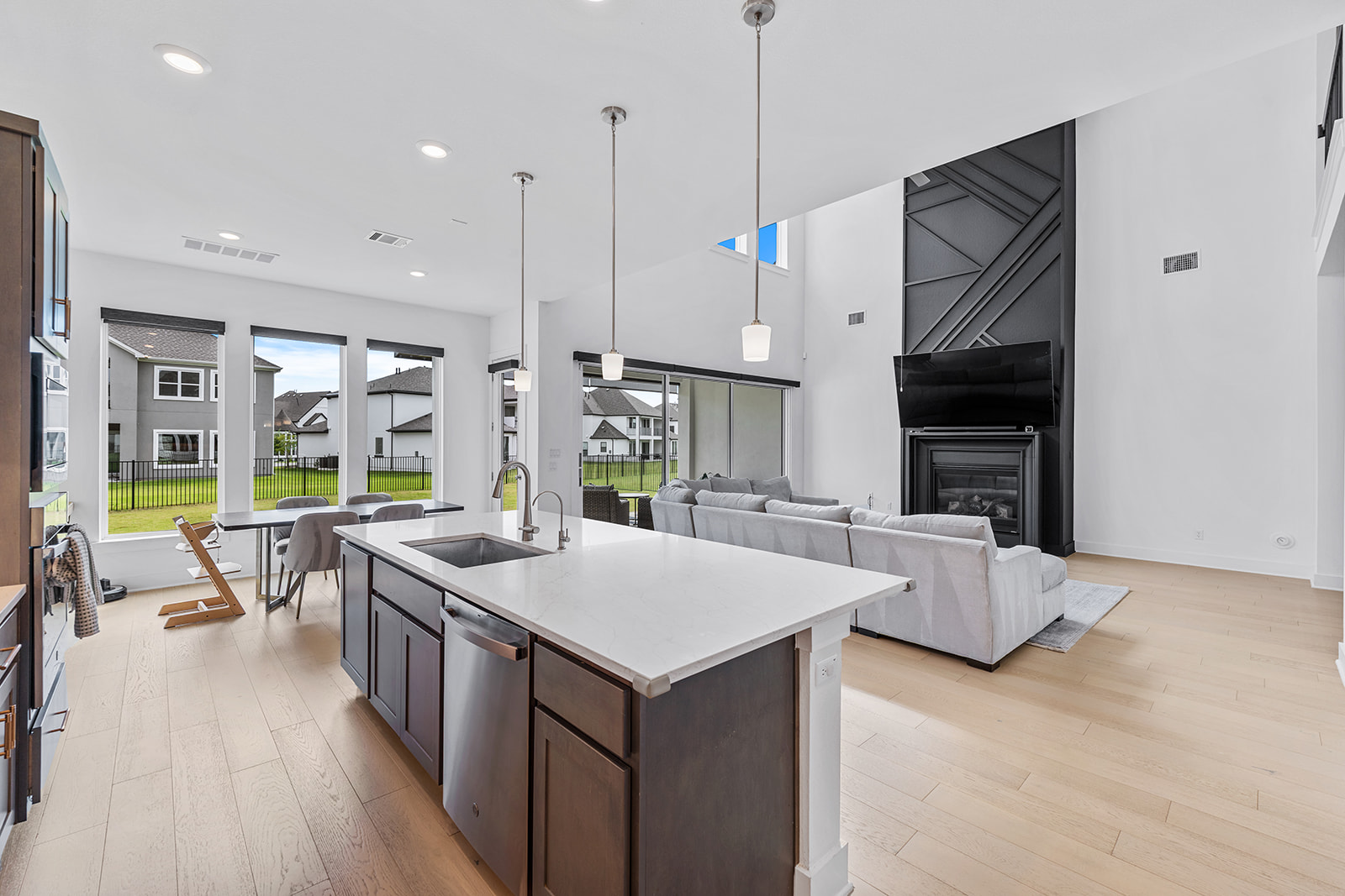 2905 Canto Trace Leander, TX 78641 - Photo 10 of 40 a open kitchen with stainless steel appliances granite countertop a stove and a wooden floors