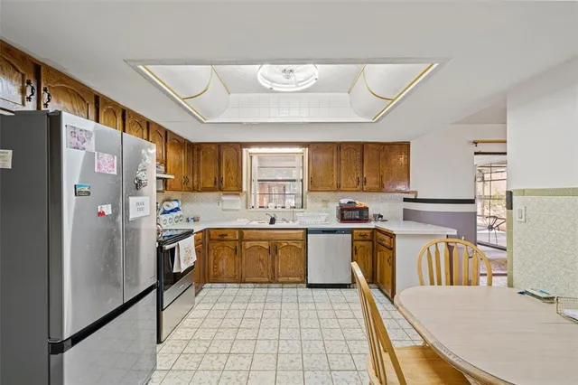 a view of living room with furniture and a chandelier