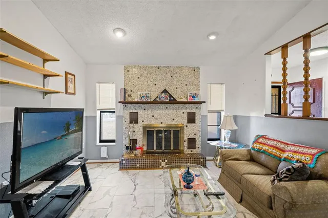 a living room with furniture and large window