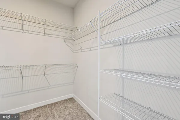 a view of a room with racks on the wall