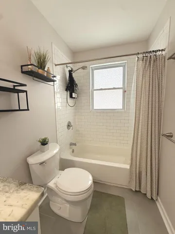 a workspace with wooden floor and a chair
