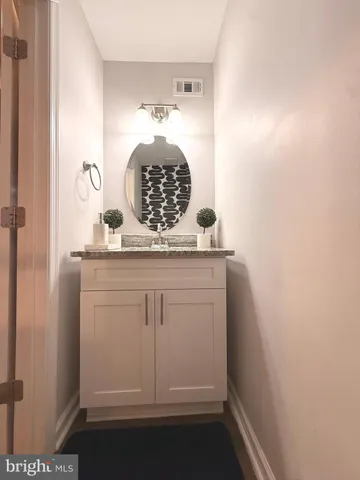 a kitchen with stainless steel appliances a stove sink and cabinets