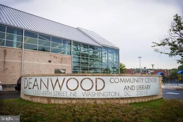 a large building with a street sign on the side of it