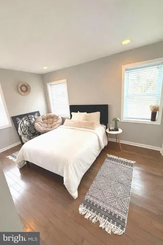 a bedroom with a large bed and a window