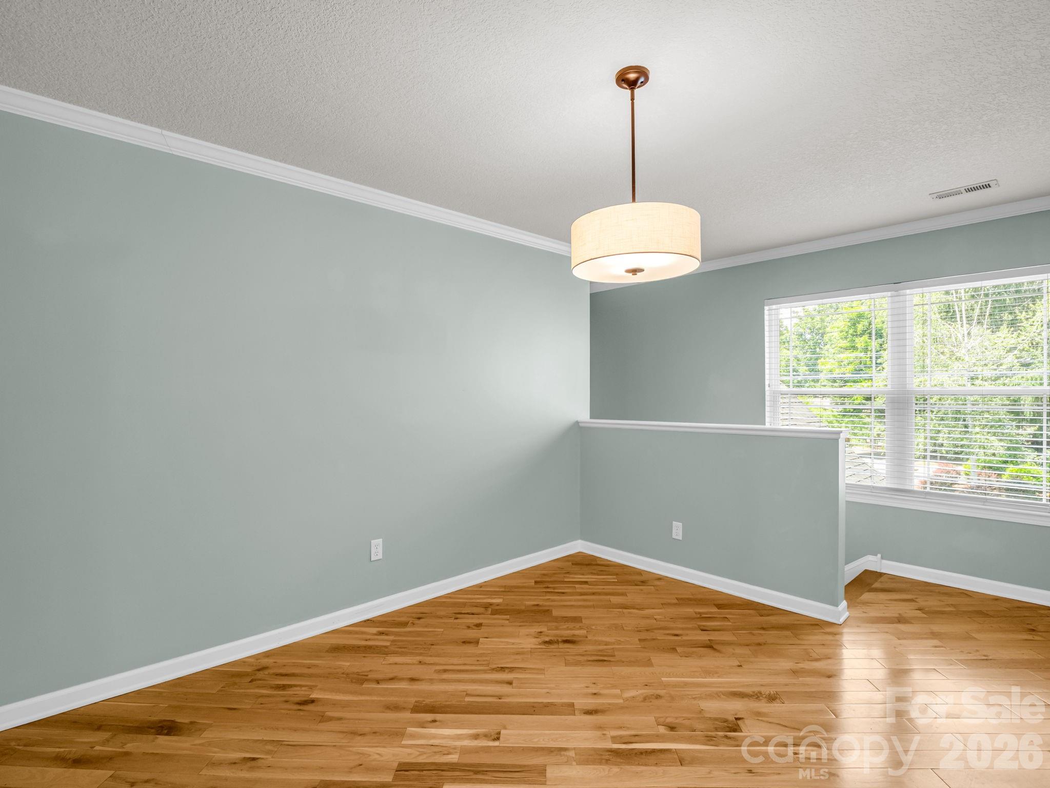 4 Rathfarnham Road, Unit 4F Asheville, NC 28803 - Photo 9 of 33 a view of a room with a window and wooden floor